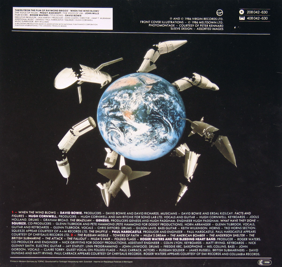 ‘Back cover of When the Wind Blows Original Motion Picture Soundtrack. The central image is a photomontage by Peter Kennard, depicting Earth surrounded by broken and deconstructed nuclear missiles, resembling a mechanical spider. The dark background contrasts with the detailed planet and missiles, reinforcing the anti-nuclear war theme. At the top left, a white text box provides credits, mentioning David Bowie for the title song, Roger Waters for the score, and voice actors Peggy Ashcroft and John Mills. Below, the tracklist appears in white and red text, featuring artists David Bowie, Roger Waters, Hugh Cornwell, Genesis, Squeeze, and Paul Hardcastle. Copyright details for Virgin Records Ltd. and Meltdown Ltd. are displayed at the top right. The overall design conveys a bleak and powerful message about nuclear conflict and its consequences.’